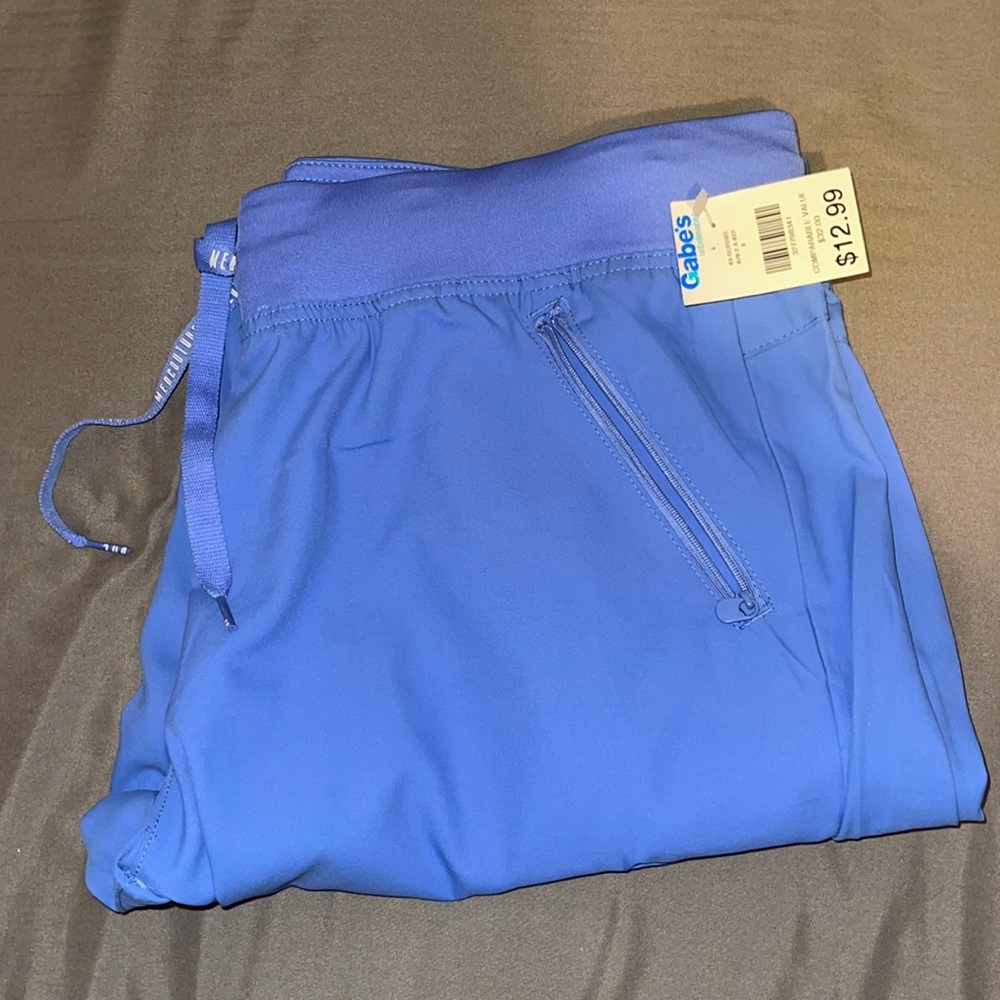 Brand new scrub pants with side pockets and zippers
